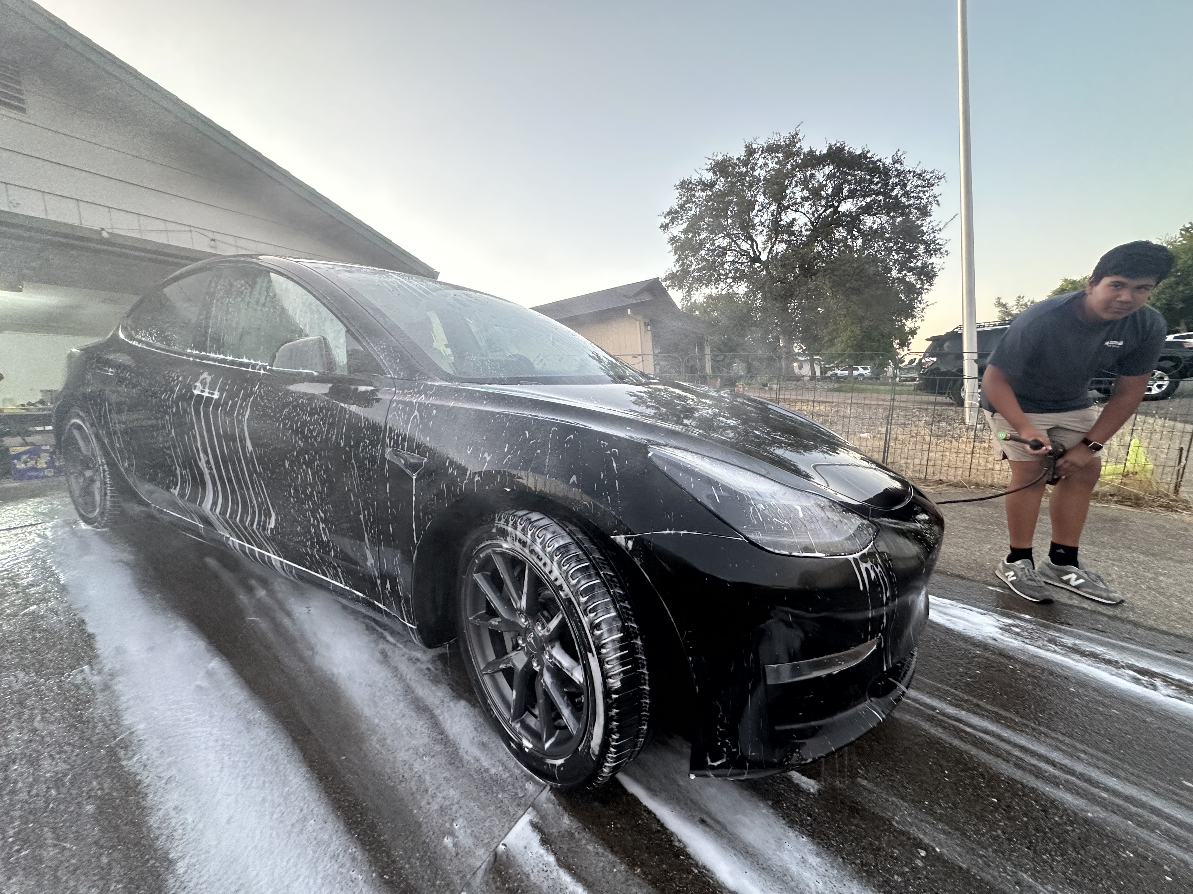 Jonah washing a sports car
